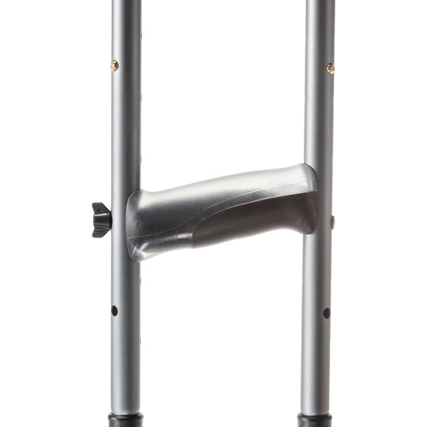 Metal crutch with a plastic handle on a white background