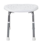 A white plastic shower seat with a perforated drainage design, supported by four adjustable silver metal legs with white non-slip feet, shown on a plain white background.