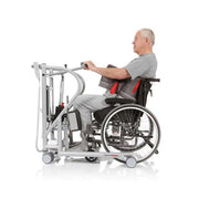 Man using a wheelchair with an assistive device on a white background