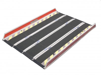 Black metal ramp with red top and yellow reflective stripes on a white background