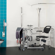 Medical equipment in a bathroom setting with blue tiles and a shower area.