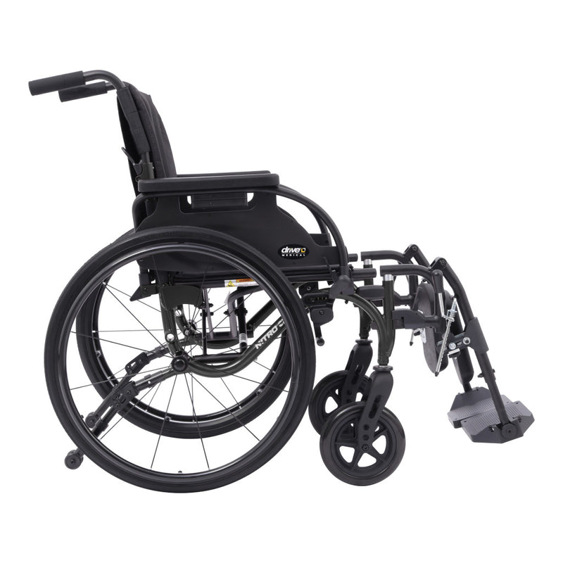 A black manual wheelchair with a folding frame, large rear wheels, small front casters, and a footrest, shown from a side angle on a plain white background.