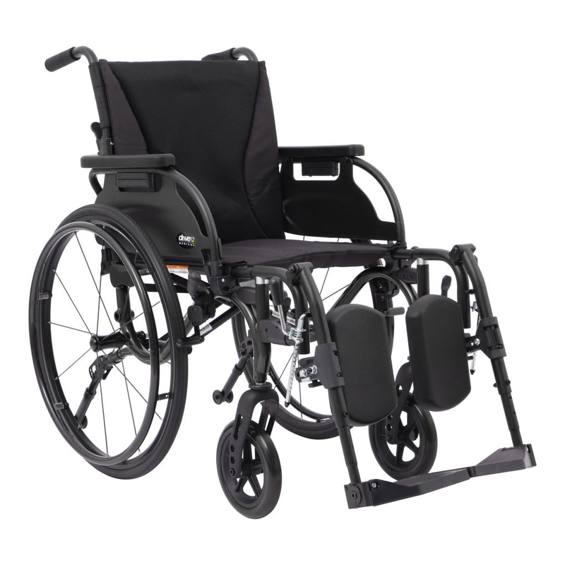 A black manual wheelchair with a black fabric seat and backrest, black metal frame, large rear wheels, and front casters, shown on a plain white background.