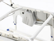 Close-up of a medical bed with control panel on a white background