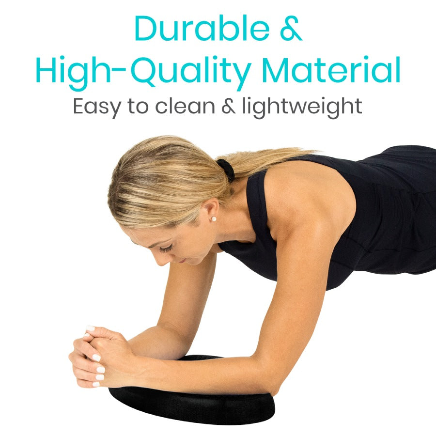Woman using a black exercise ball with text about material quality on a white background