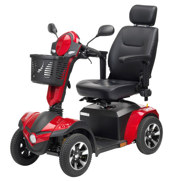 Red and black mobility scooter with a basket on a white background