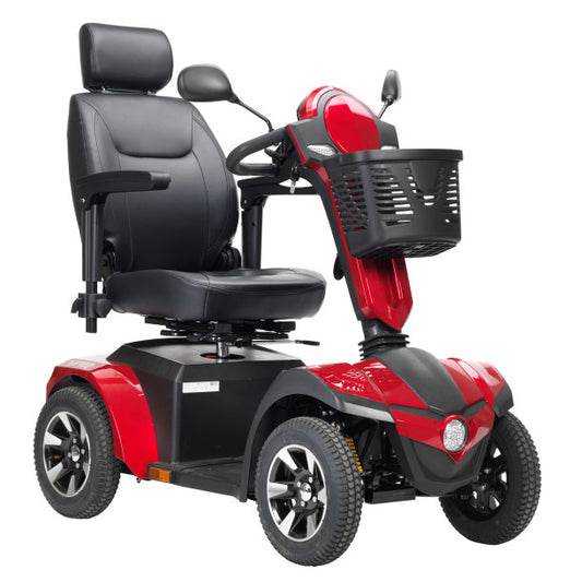 Red and black mobility scooter with a basket on a white background