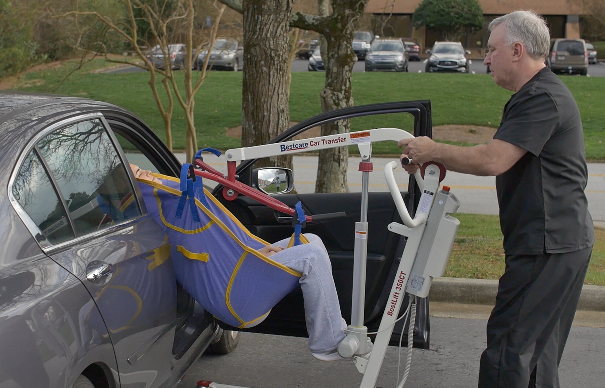 View of PL350CT Transfer Lift being used to transfer patient into a car