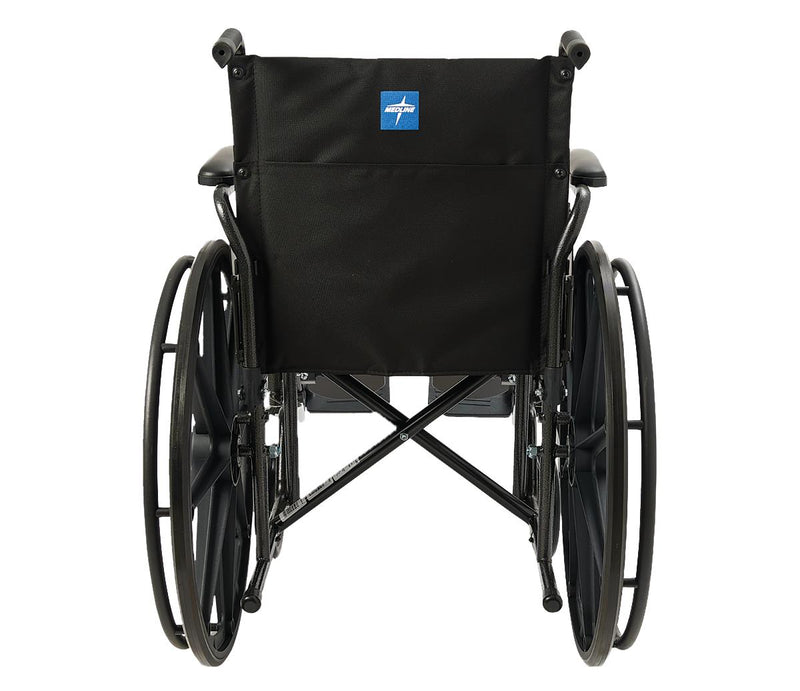 A black manual wheelchair shown from the rear, featuring a black fabric backrest with a small blue and white logo patch, black armrests, and large black wheels on a plain white background.
