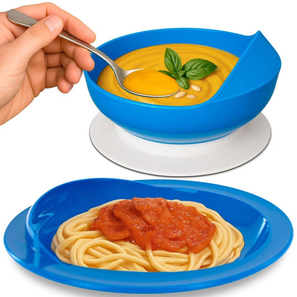 Blue bowl with yellow soup and basil leaves, and blue plate with spaghetti and red sauce on a white background.