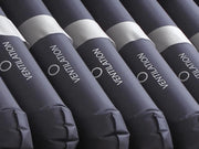 Rolls of insulation labeled 'Ventilation' arranged in a row.