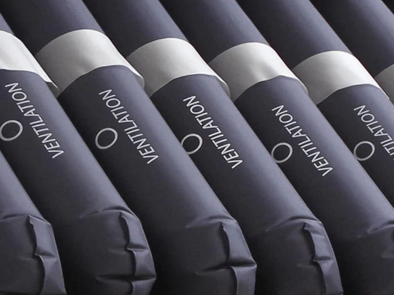 Rolls of insulation labeled 'Ventilation' arranged in a row.