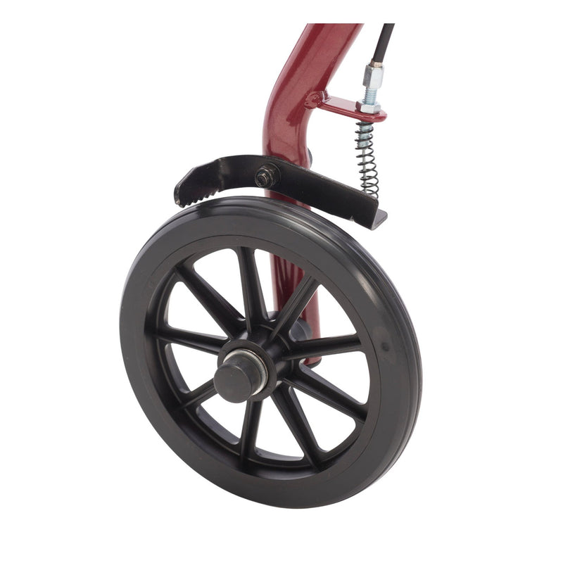 Close-up of a wheelchair wheel with red frame and black wheel on a white background