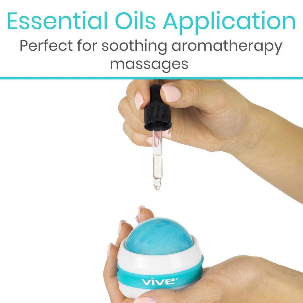Hand holding a blue and white Vive essential oils application device with a dropper.