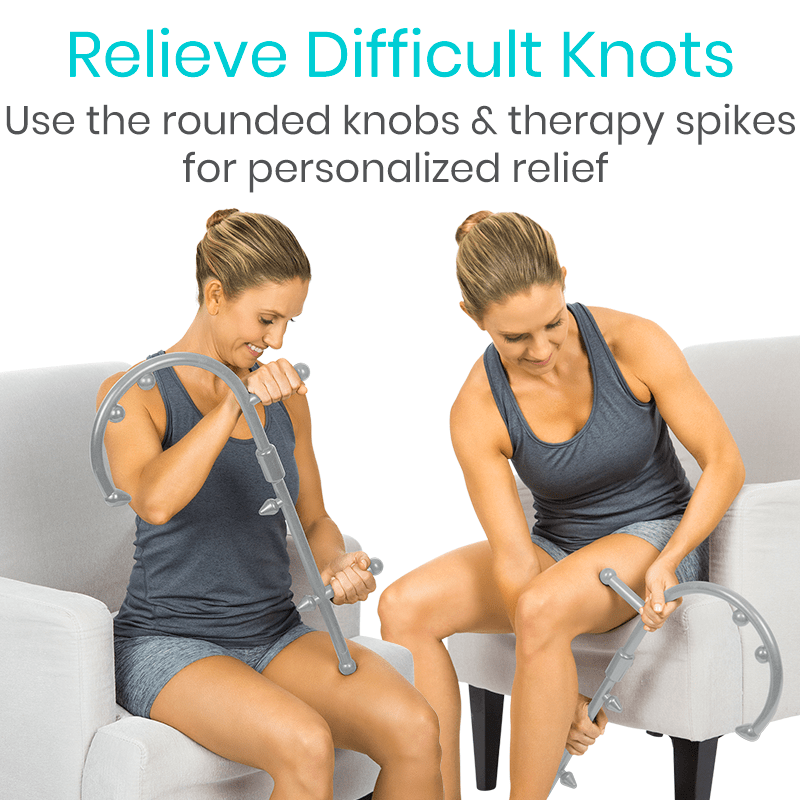 Woman using a device with rounded knobs and therapy spikes on a couch.