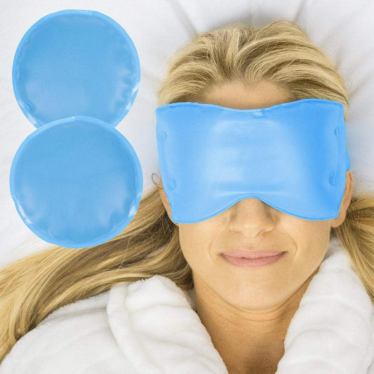 Woman wearing a blue eye mask with two blue gel packs on a white background