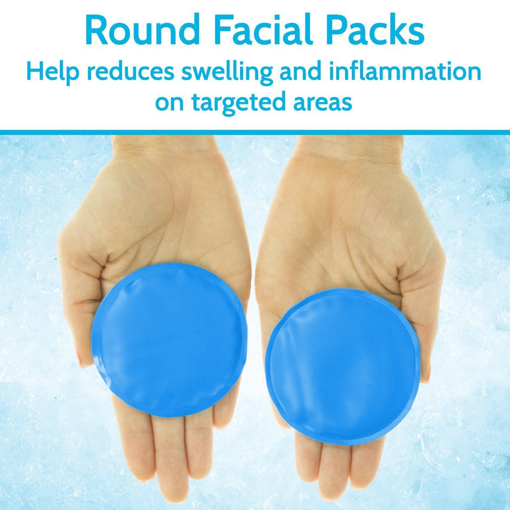 Two hands holding blue round facial packs against a light blue background.