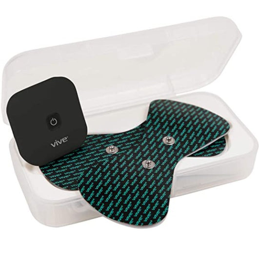 Vive device with a black cover and green patterned mat inside a clear plastic case on a white background