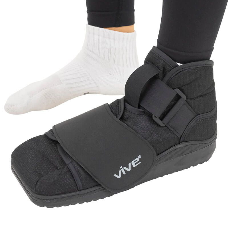 Black foot cast with straps on a white background