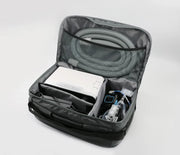 Black backpack with medical equipment inside on a white background