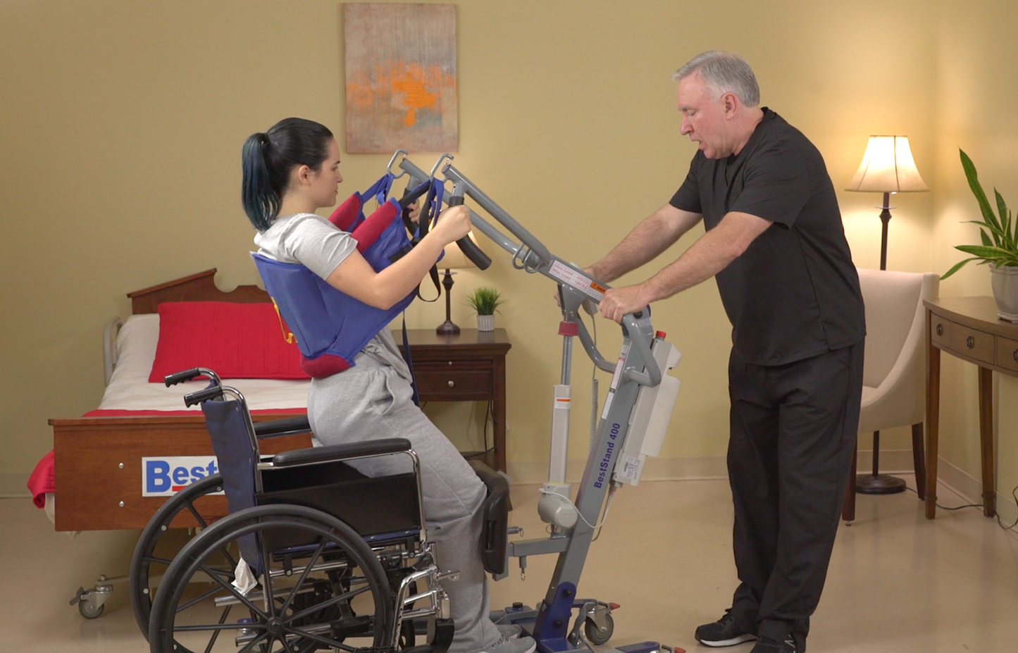 SA500 Patient Lift lifitng patient out of wheelchair
