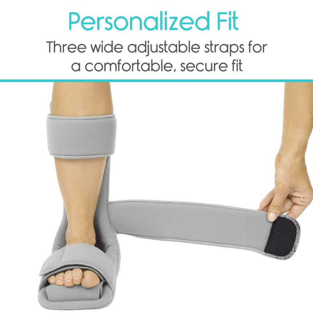 Gray ankle support brace with adjustable straps on a white background