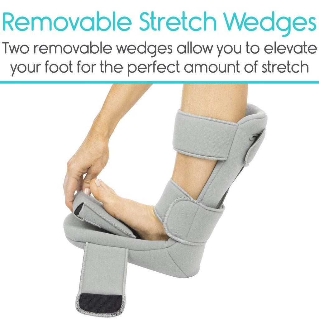 Gray foot orthosis with removable stretch wedges on a white background