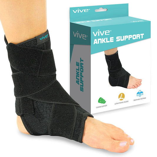 Black ankle support brace worn by a person with 'Vive' packaging in the background.