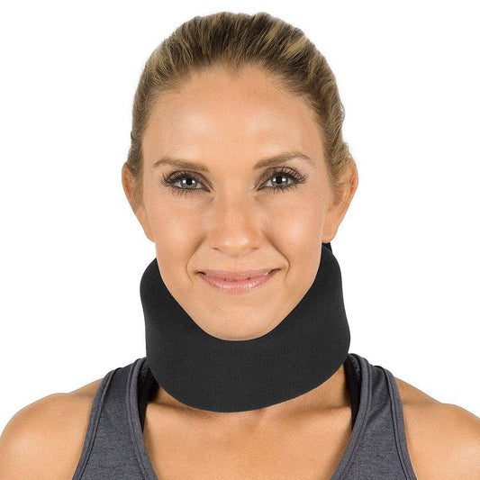 Woman wearing a black neck brace against a white background
