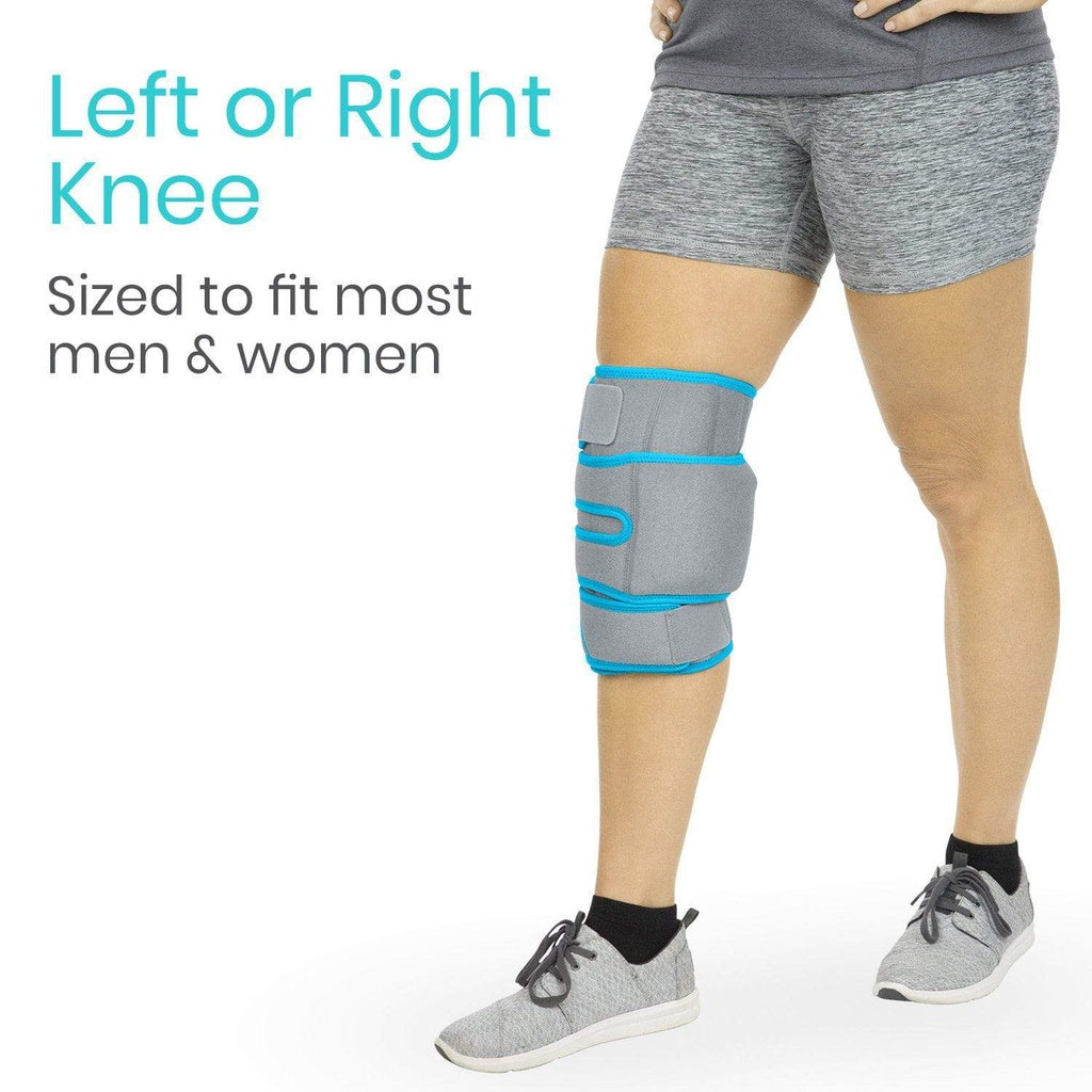 Person wearing a gray knee brace with blue accents on a white background