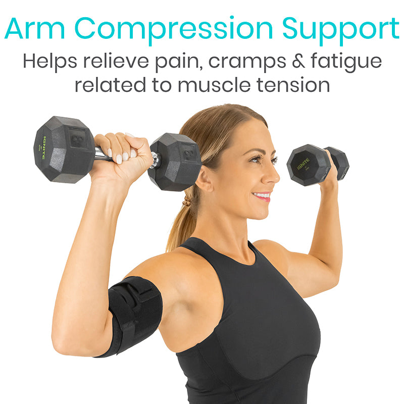 Woman exercising with arm compression support and dumbbells on a white background