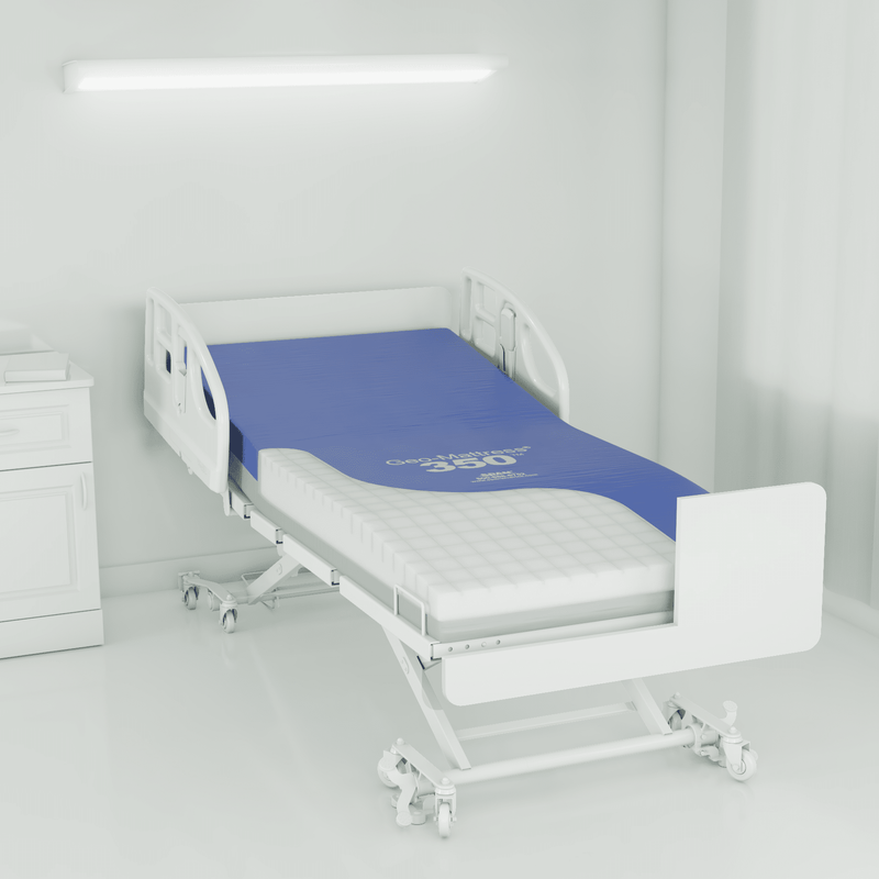 Hospital bed with blue mattress in a room setting