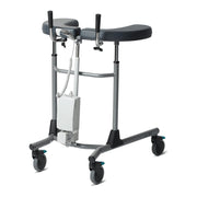 A medical standing frame with a dark gray padded seat and armrests, a silver metal frame, and four caster wheels, shown on a plain white background.
