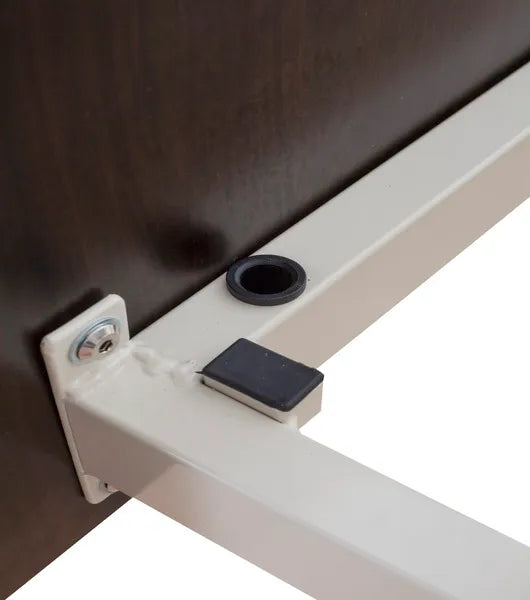 Close-up of a metal bracket attached to a wooden surface