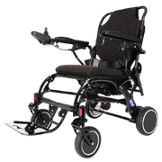 A black electric motorized wheelchair with a dark brown textured seat and backrest, shown from a three-quarter angle against a solid white background.
