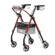 A rollator walker with a red metal frame, black seat, gray backrest, and four wheels, shown on a plain white background.