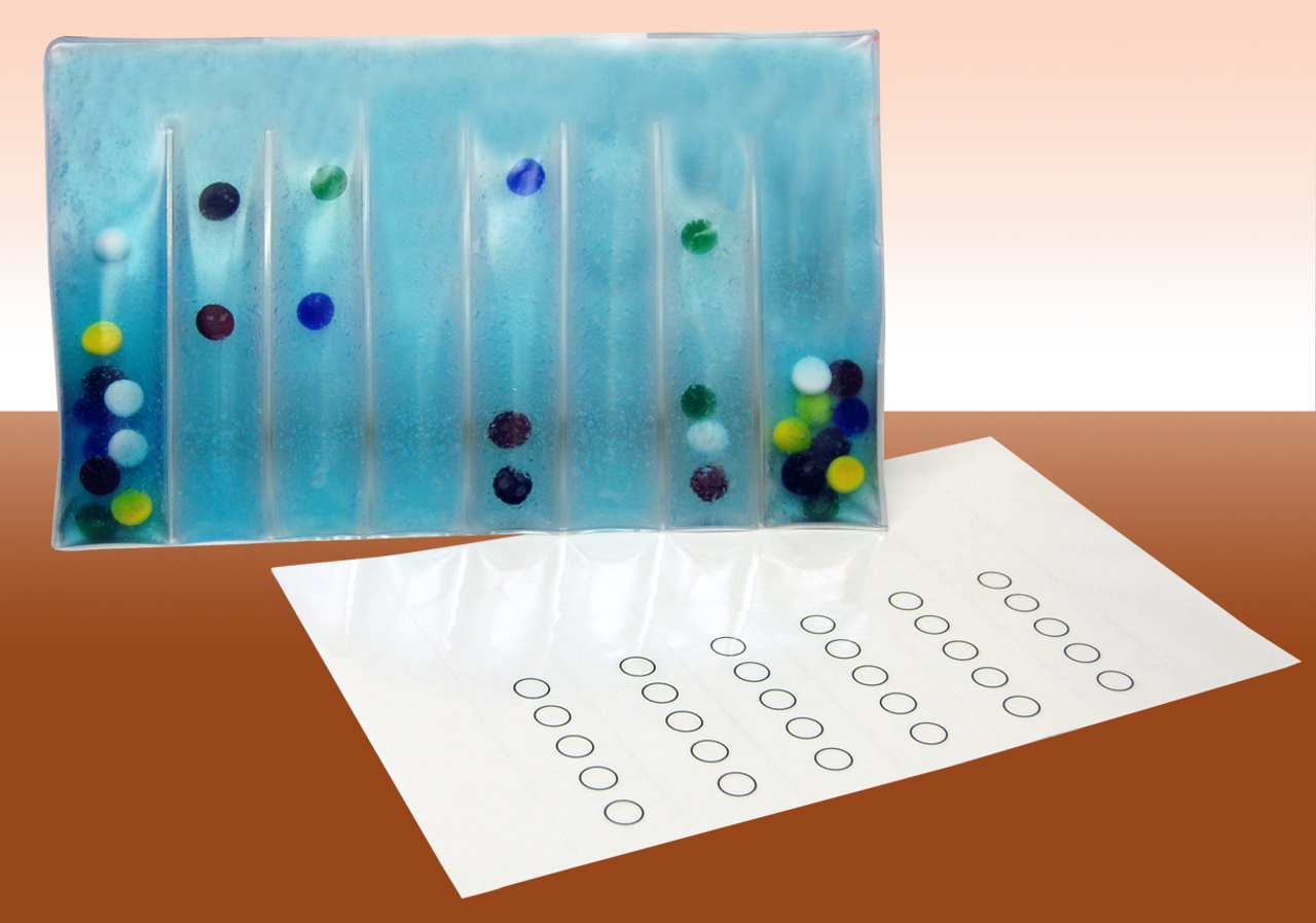 Decorative glass panel with colored dots on a brown surface