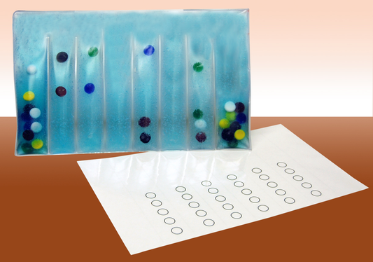 Decorative glass panel with colored dots on a brown surface