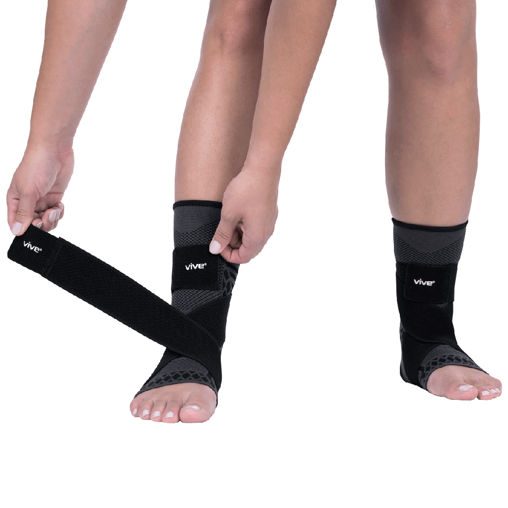 Person wearing black Vive ankle support on a transparent background