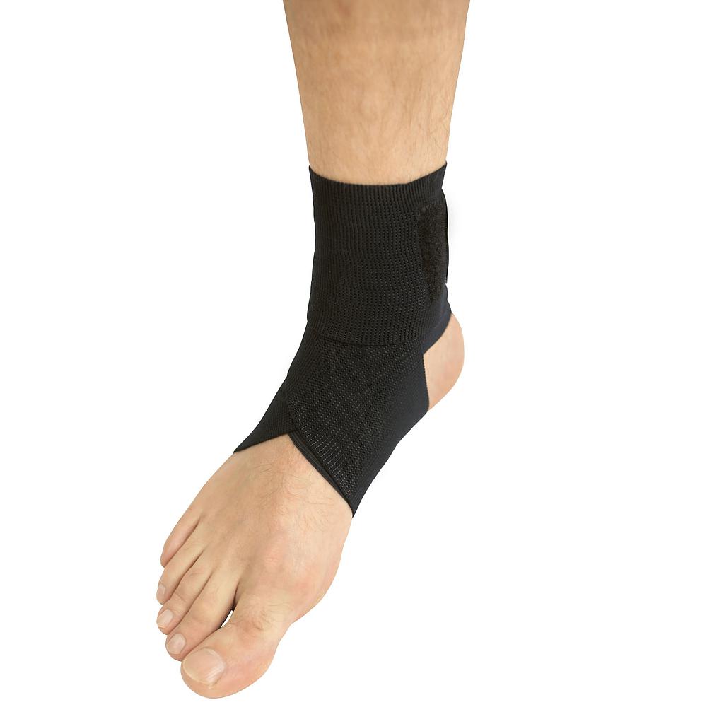 Black ankle support brace on a foot against a white background