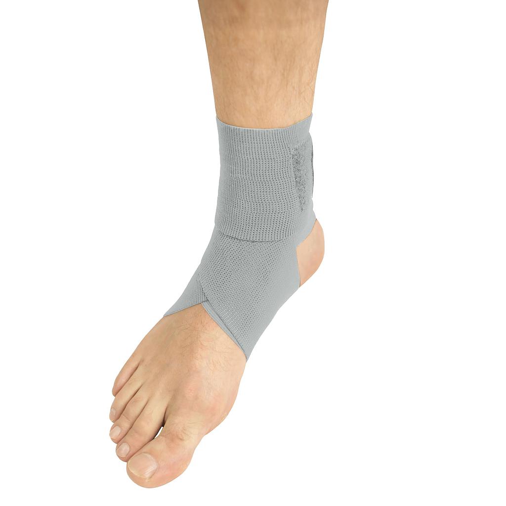 Gray ankle support brace on a person's foot against a white background