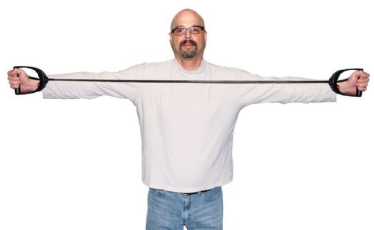 Man wearing a white shirt with extended sleeves on a white background