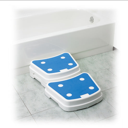 Two step stools with blue platforms on a tiled bathroom floor.