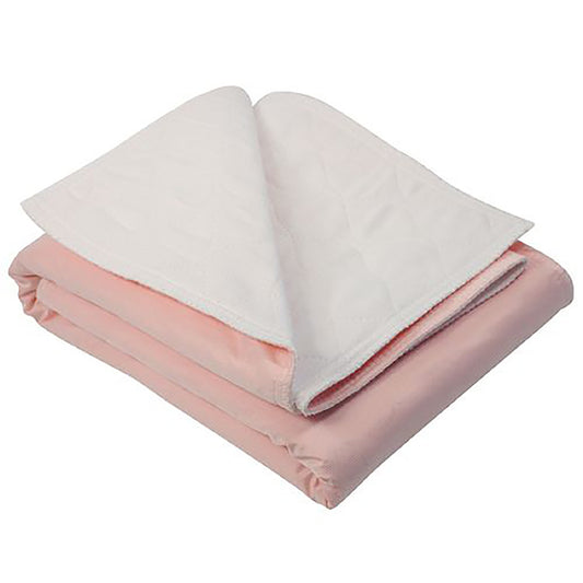 Folded pink and white blanket on a white background