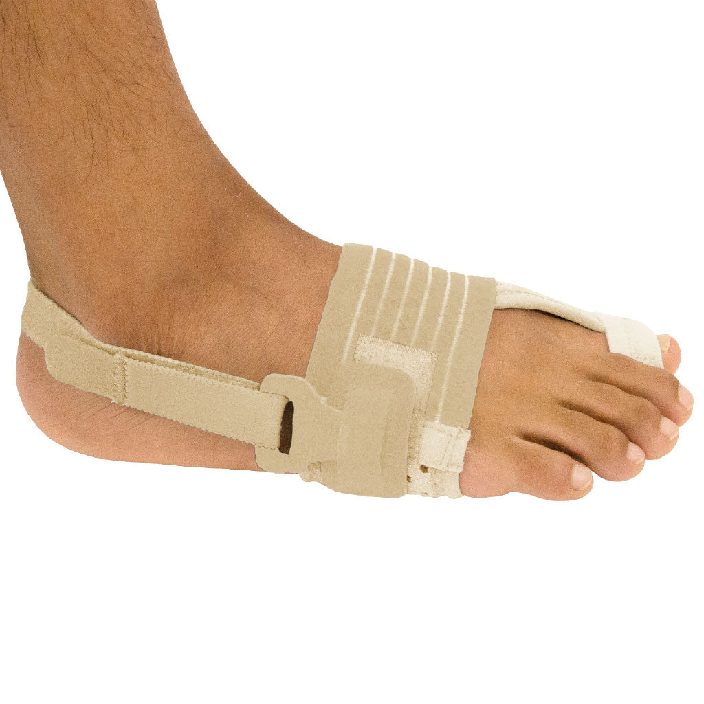 Beige bunion corrector on a foot against a white background