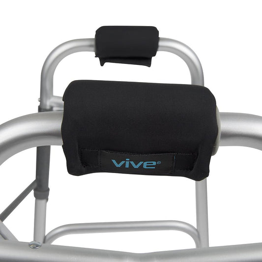 Black armrest covers with 'vive' branding on a walker frame.