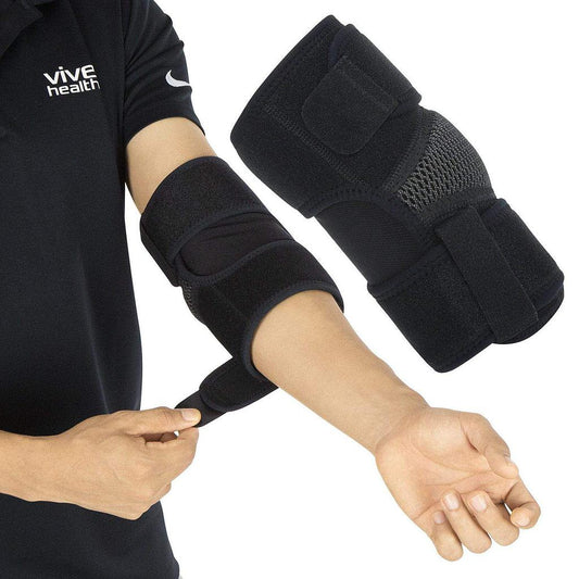 Person wearing black Vive health elbow supports on both arms.