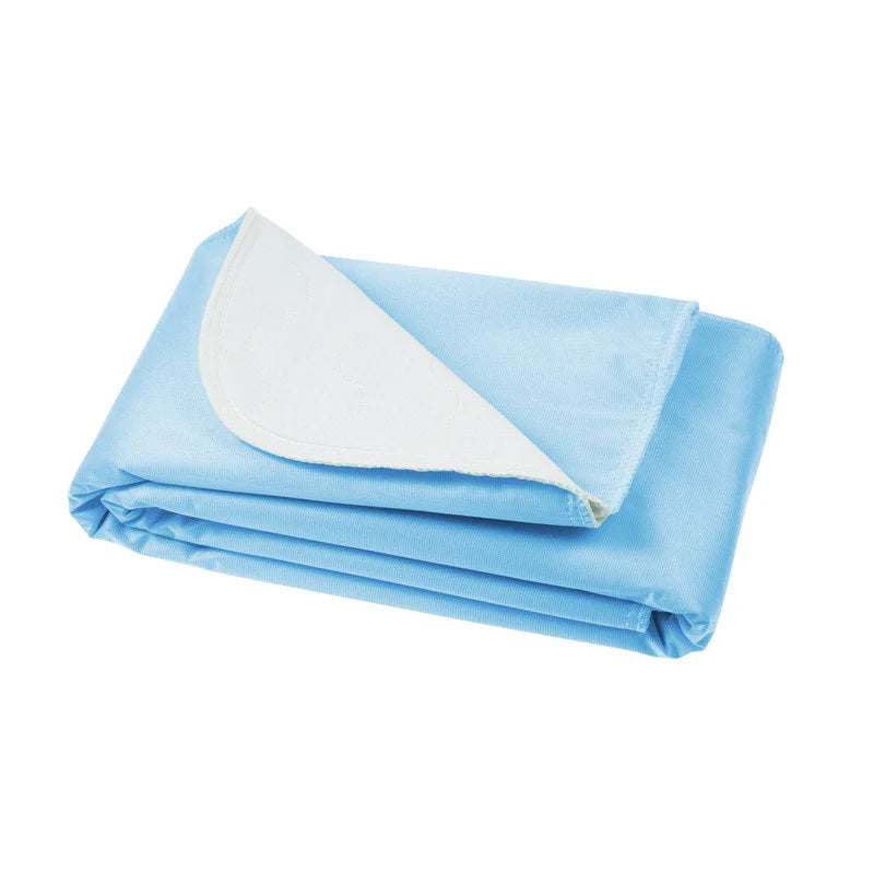 Folded blue blanket with a white inner layer on a white background