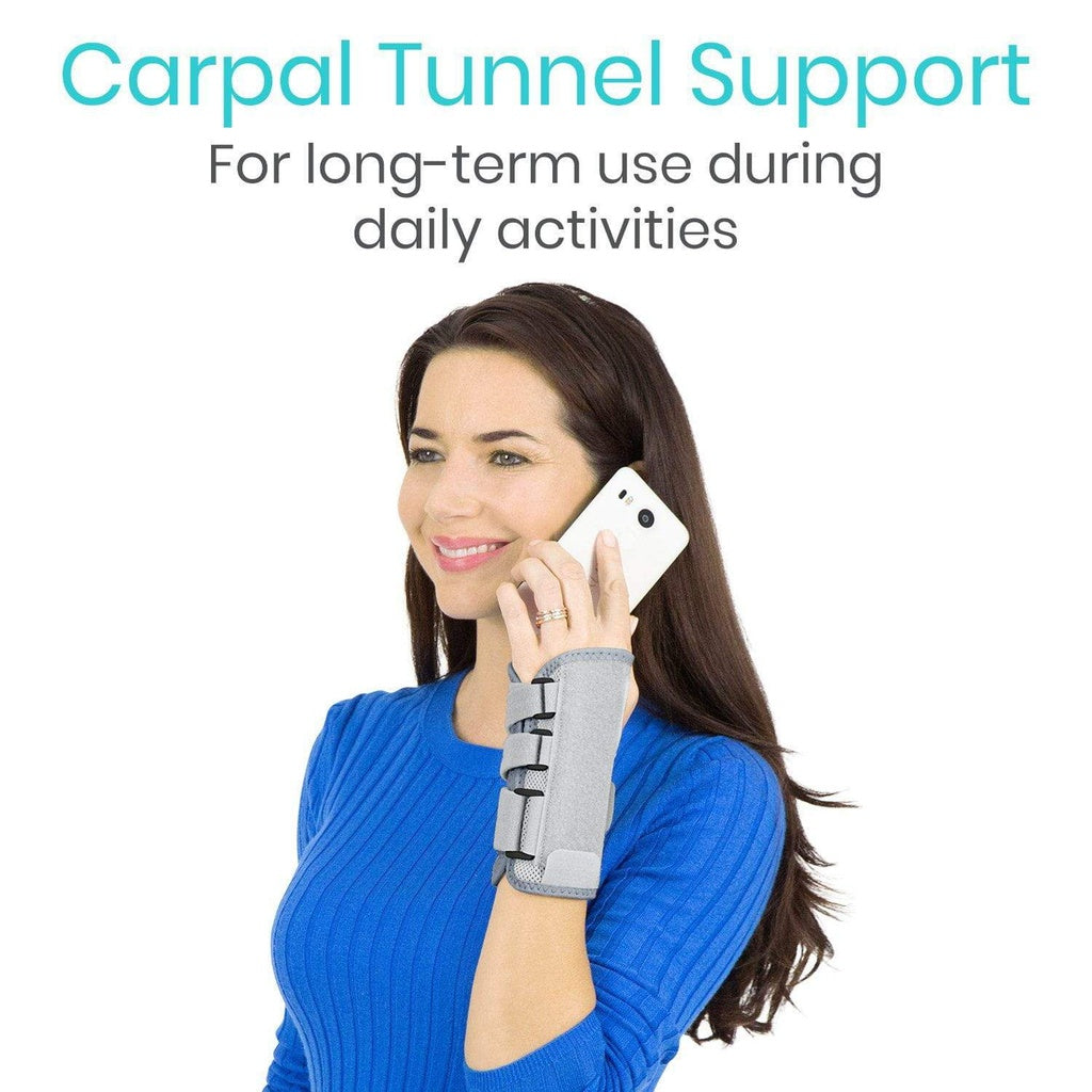 Woman using a phone with a carpal tunnel support brace on her wrist, on a white background.