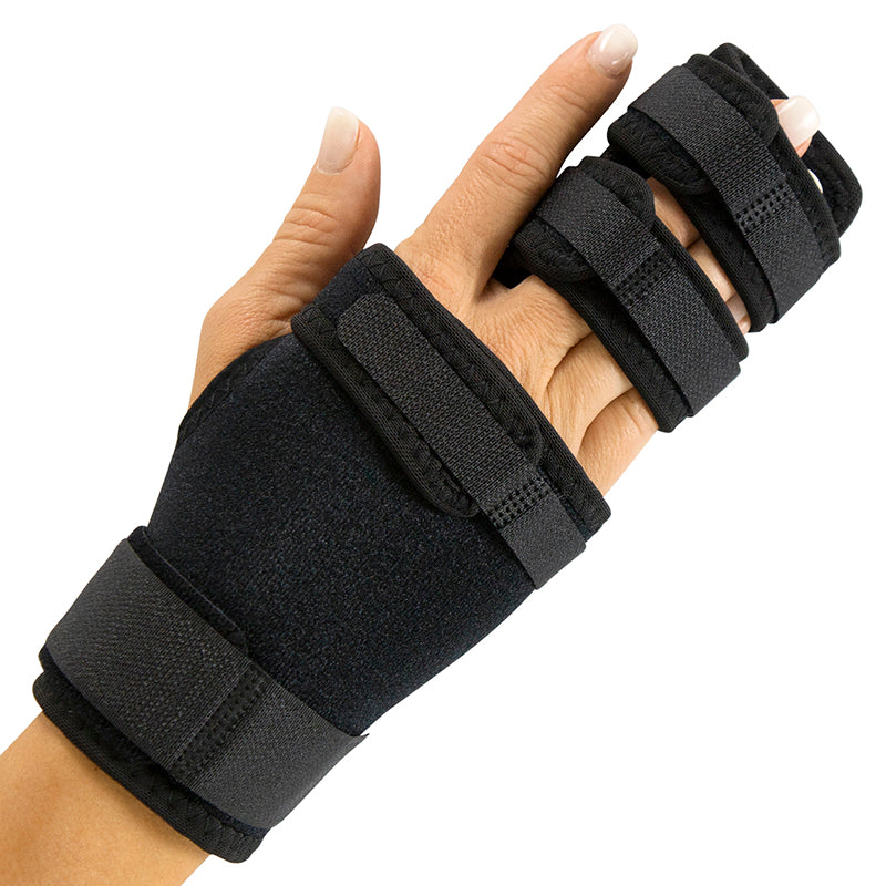Black wrist support brace on a hand against a white background